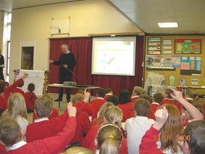 Children at Richard Whittington Primary, Bishop's Stortford asking questions during a presentation about Stansted Airport